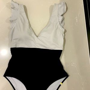One piece summersalt suit, ruffle backflip style